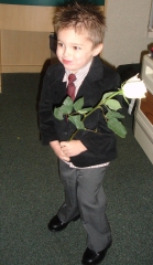 Ethan giving a flower to his mother.